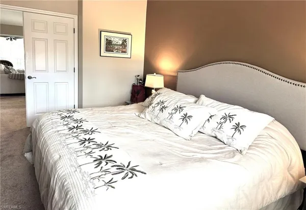 a bedroom with a bed and a cabinets