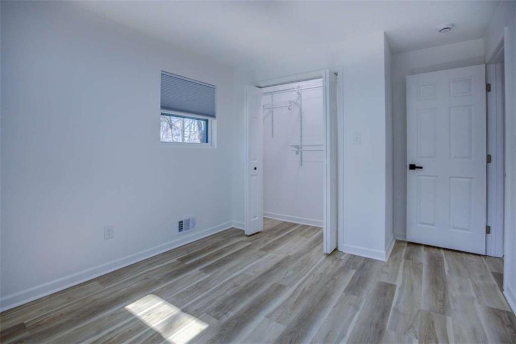7225 Pineneedle Drive Southwest Covington, GA 30014 - Photo 25 of 37 a view of room with wooden floor and window