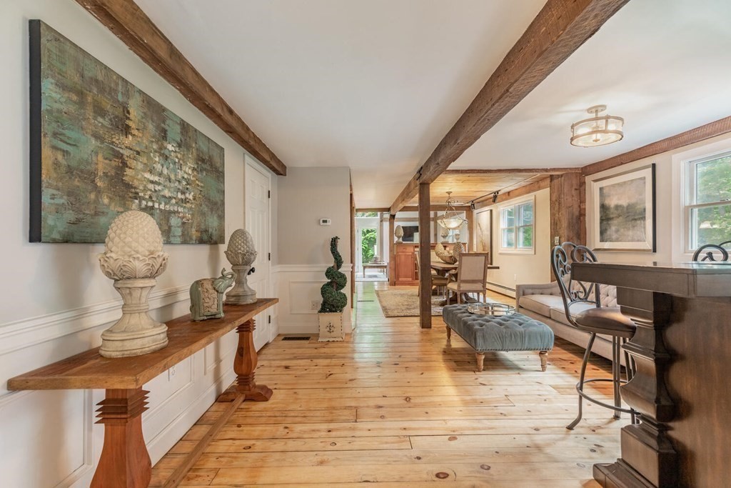 373 Ipswich Road Boxford, MA 01921 - Photo 11 of 37 a living room with fireplace furniture and a large window