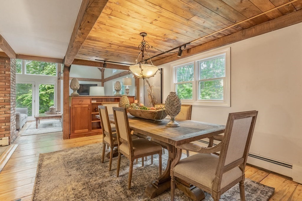 373 Ipswich Road Boxford, MA 01921 - Photo 14 of 37 a dining room with furniture a chandelier and wooden floor
