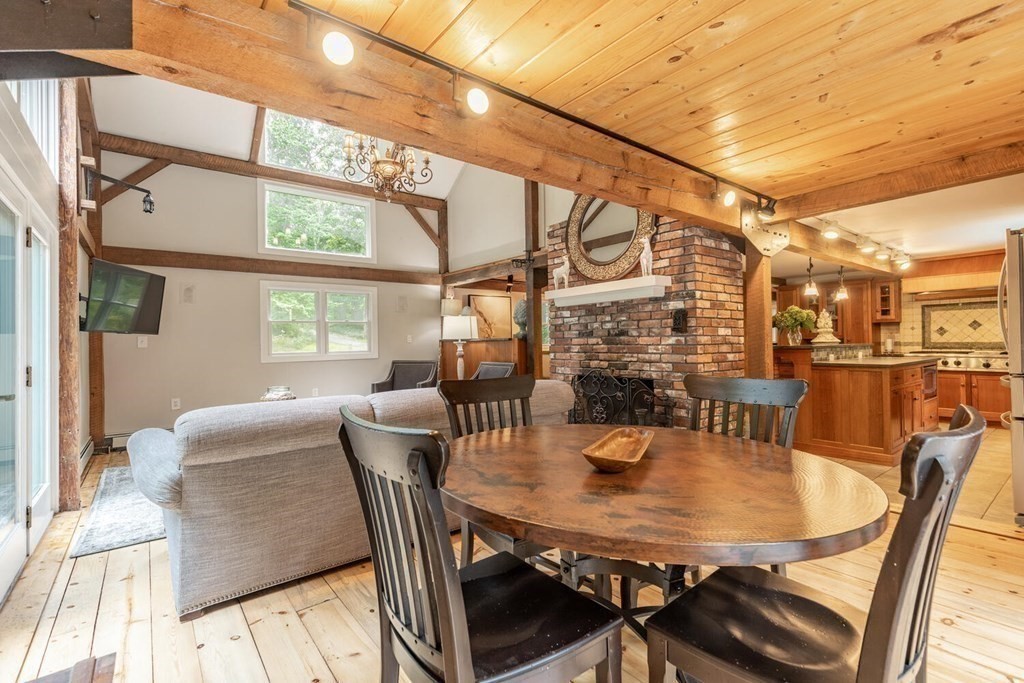 373 Ipswich Road Boxford, MA 01921 - Photo 16 of 37 a view of a dining room with furniture a chandelier and wooden floor