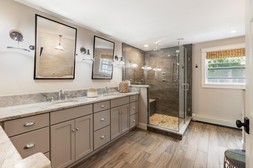 373 Ipswich Road Boxford, MA 01921 - Photo 18 of 37 a bathroom with a double vanity sink mirror and shower