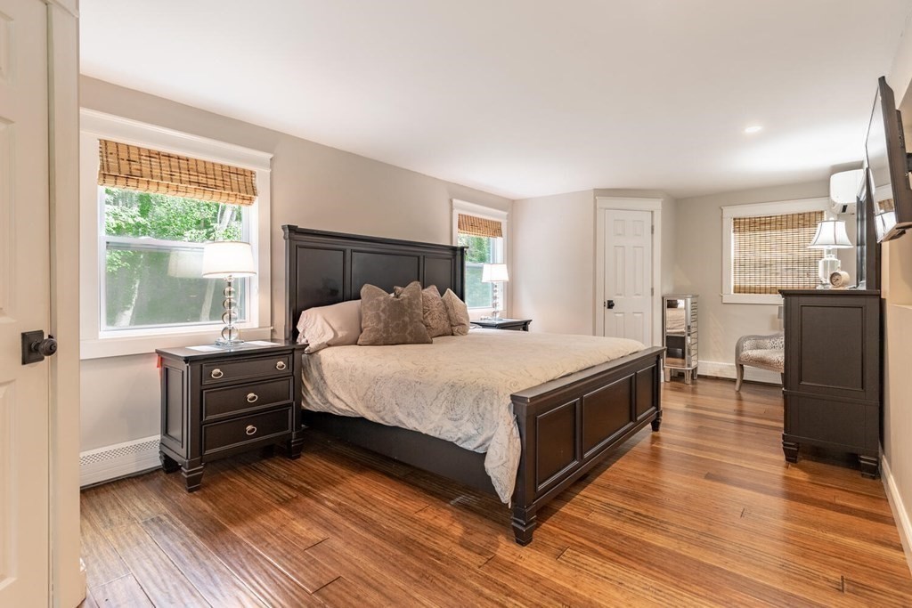 373 Ipswich Road Boxford, MA 01921 - Photo 20 of 37 a bedroom with a bed and wooden floor
