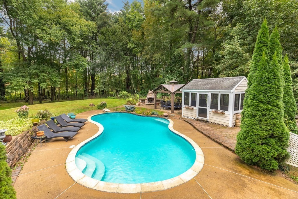 373 Ipswich Road Boxford, MA 01921 - Photo 3 of 37 a view of a swimming pool with a yard