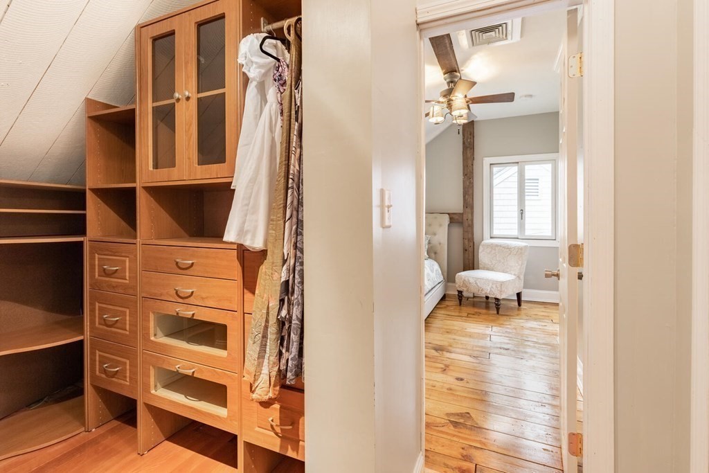 373 Ipswich Road Boxford, MA 01921 - Photo 32 of 37 a view of walk in closet with empty racks