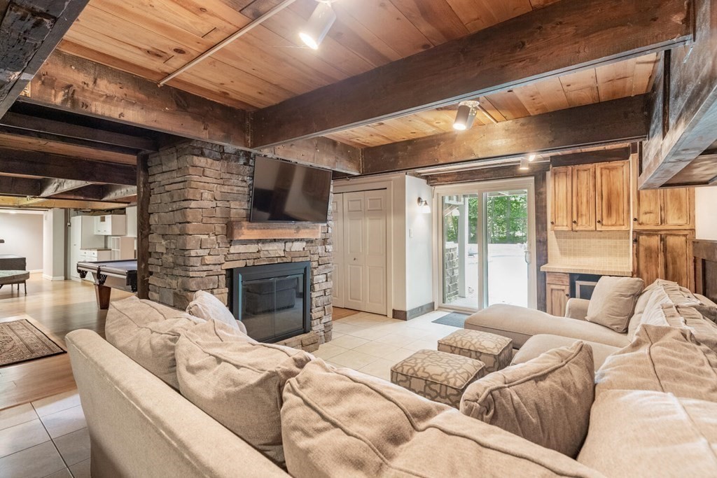 373 Ipswich Road Boxford, MA 01921 - Photo 36 of 37 a bedroom with furniture and a fireplace
