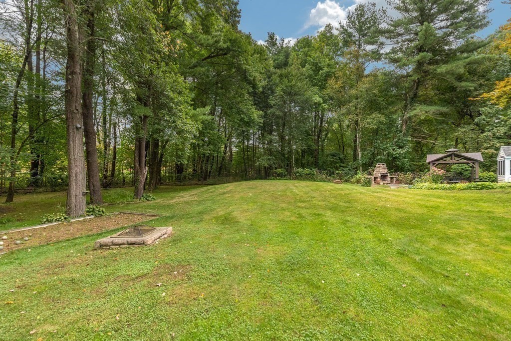 373 Ipswich Road Boxford, MA 01921 - Photo 37 of 37 a backyard of a house with lots of green space and fountain