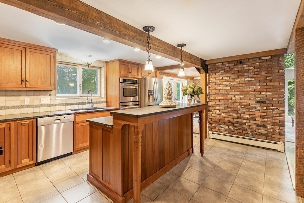 373 Ipswich Road Boxford, MA 01921 - Photo 9 of 37 a kitchen with stainless steel appliances granite countertop a stove a sink and a refrigerator