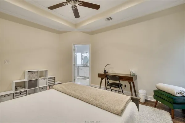 a bedroom with a bed and a chair