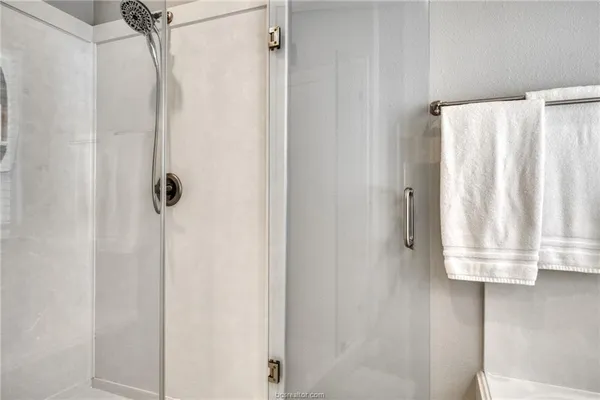 a bathroom with a shower curtain and a window