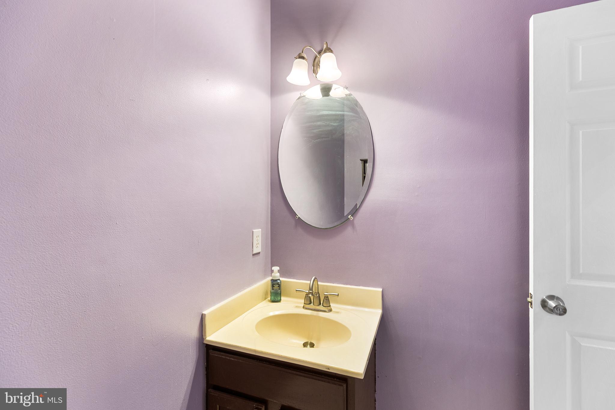 6 Sunset Hollow Road West Chester, PA 19380 - Photo 19 of 46 a bathroom with a sink and a mirror