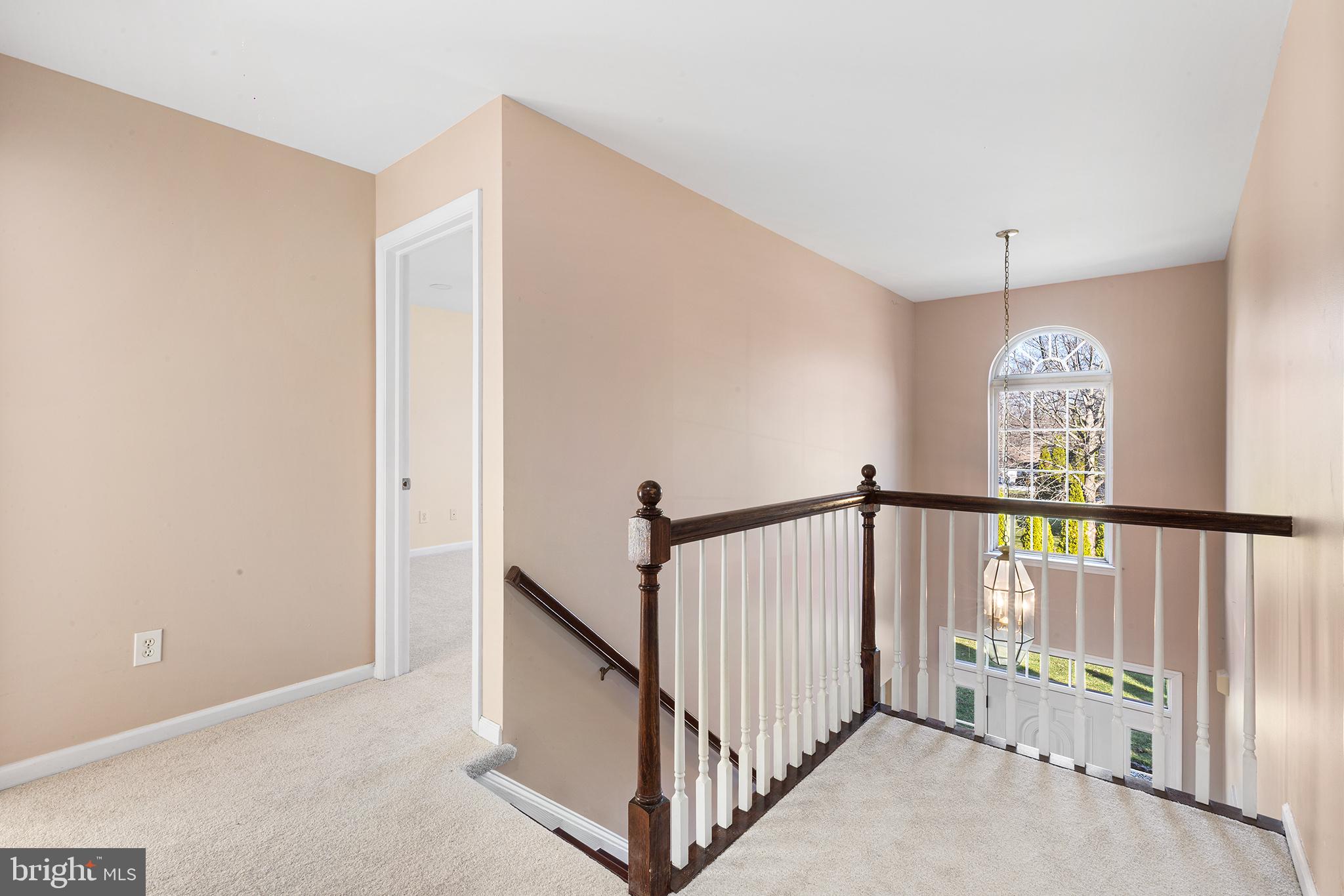 6 Sunset Hollow Road West Chester, PA 19380 - Photo 20 of 46 a view of staircase with railing and white walls