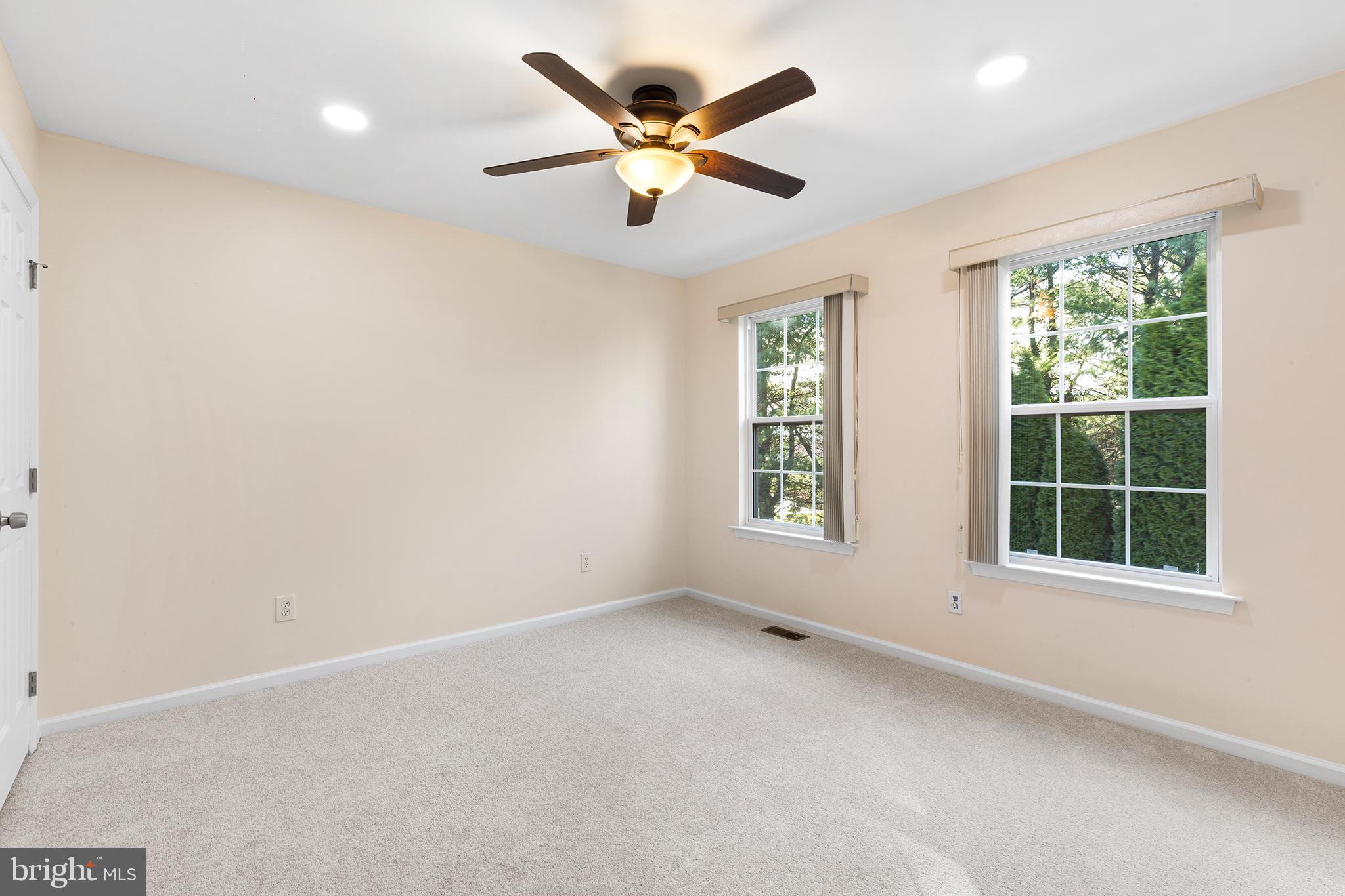 6 Sunset Hollow Road West Chester, PA 19380 - Photo 31 of 46 an empty room with window and ceiling fan