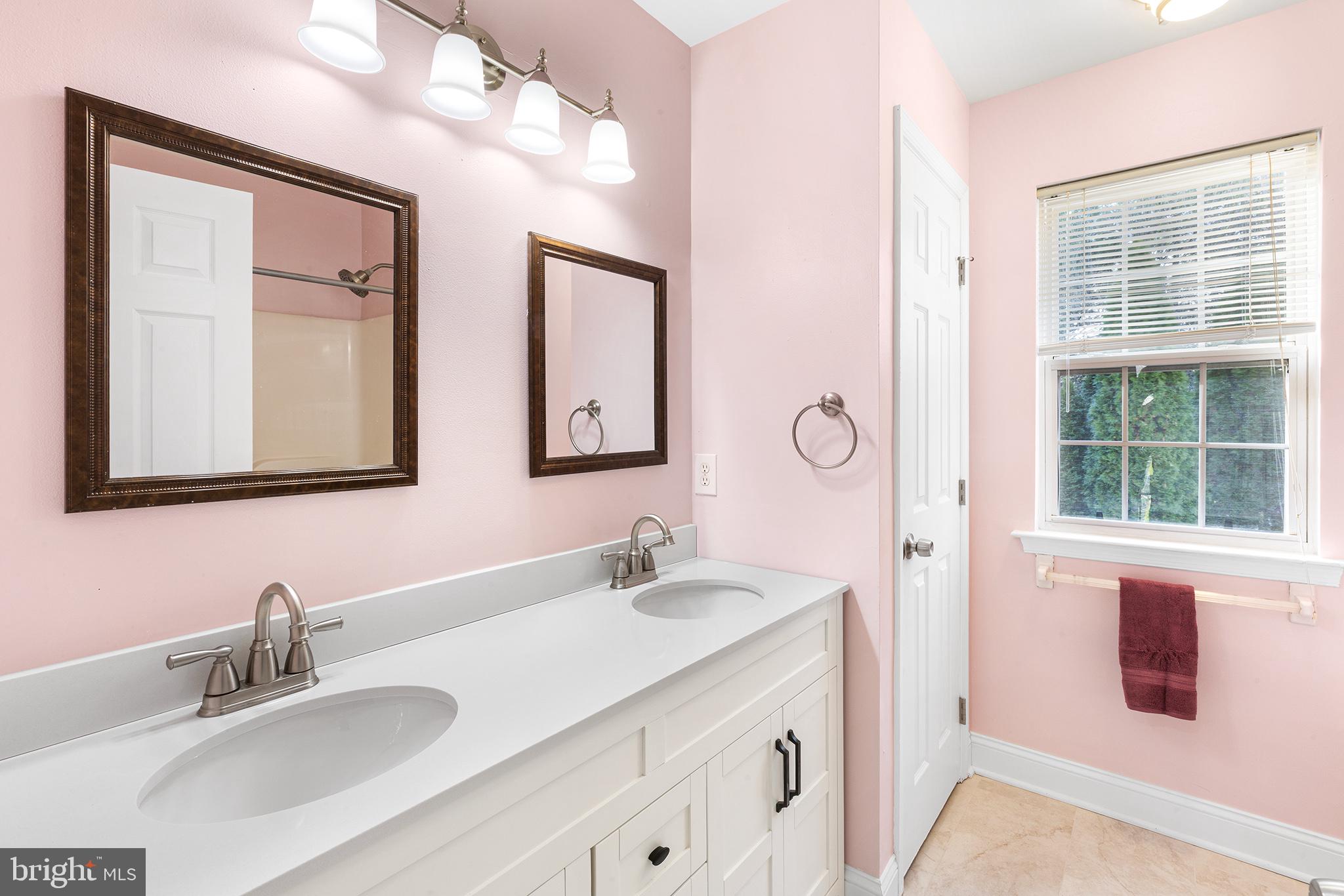 6 Sunset Hollow Road West Chester, PA 19380 - Photo 33 of 46 a bathroom with a sink vanity and mirror