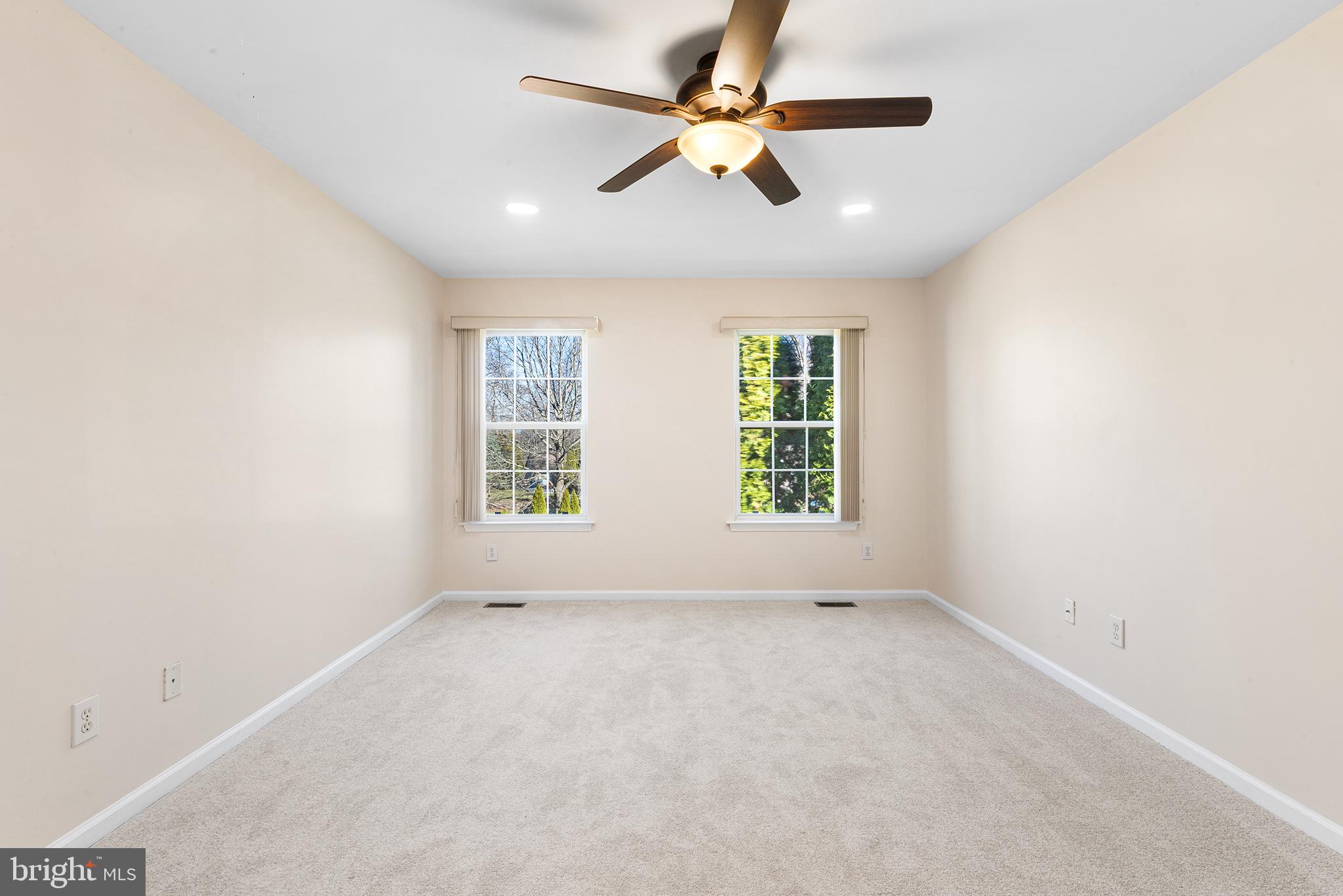 6 Sunset Hollow Road West Chester, PA 19380 - Photo 35 of 46 an empty room with windows and ceiling fan