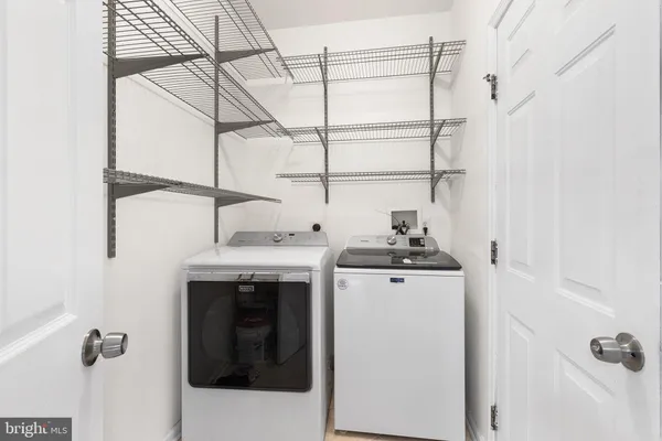 a utility room with dryer and washer