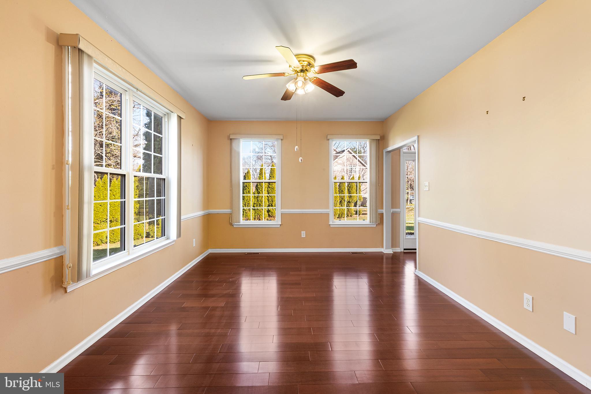 6 Sunset Hollow Road West Chester, PA 19380 - Photo 5 of 46 a view of an empty room with wooden floor and a window