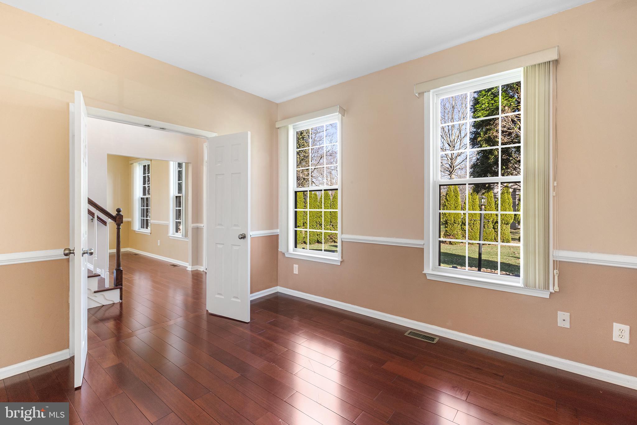 6 Sunset Hollow Road West Chester, PA 19380 - Photo 7 of 46 a view of an empty room with wooden floor and a window