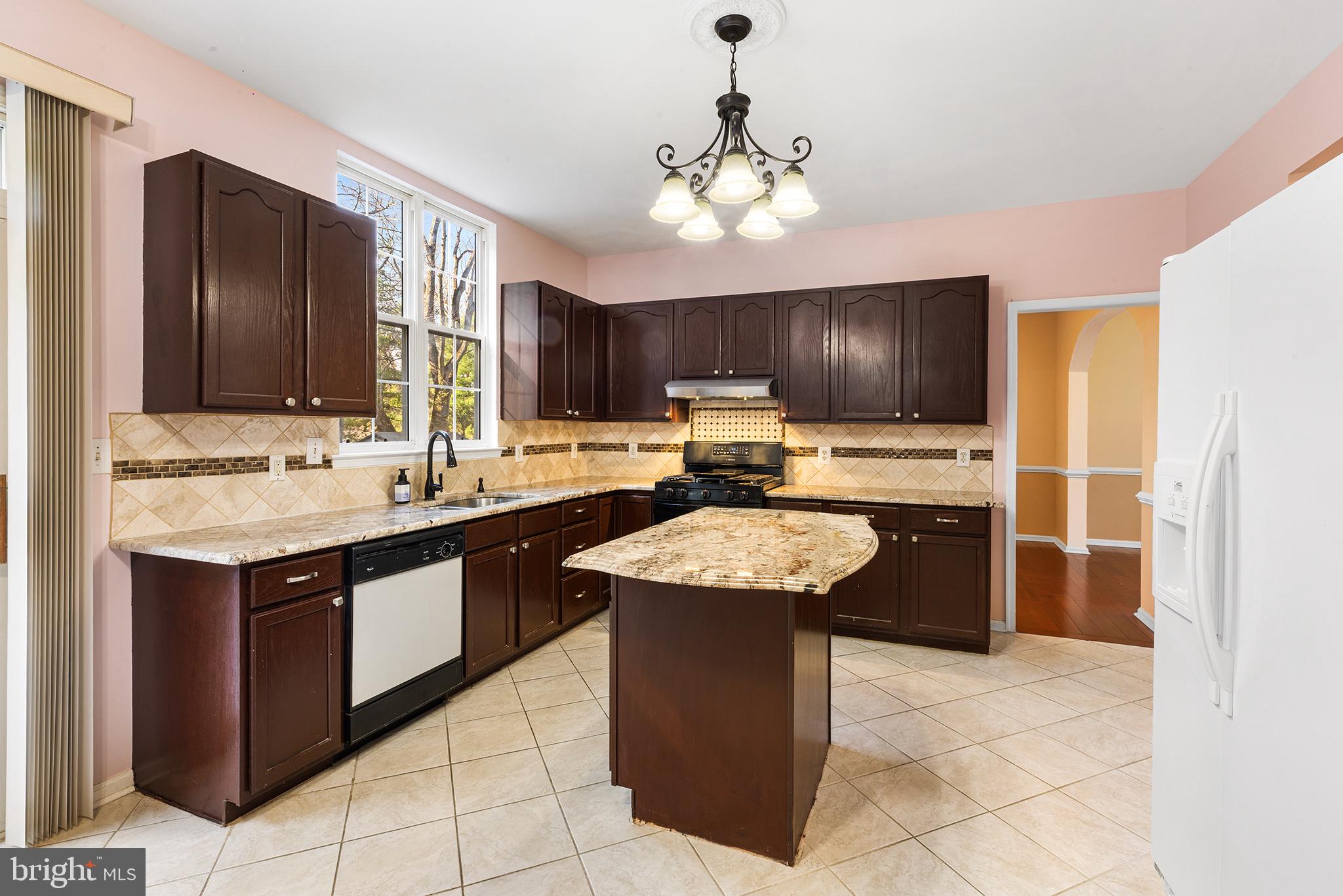6 Sunset Hollow Road West Chester, PA 19380 - Photo 9 of 46 a kitchen with stainless steel appliances granite countertop wooden cabinets a sink and dishwasher