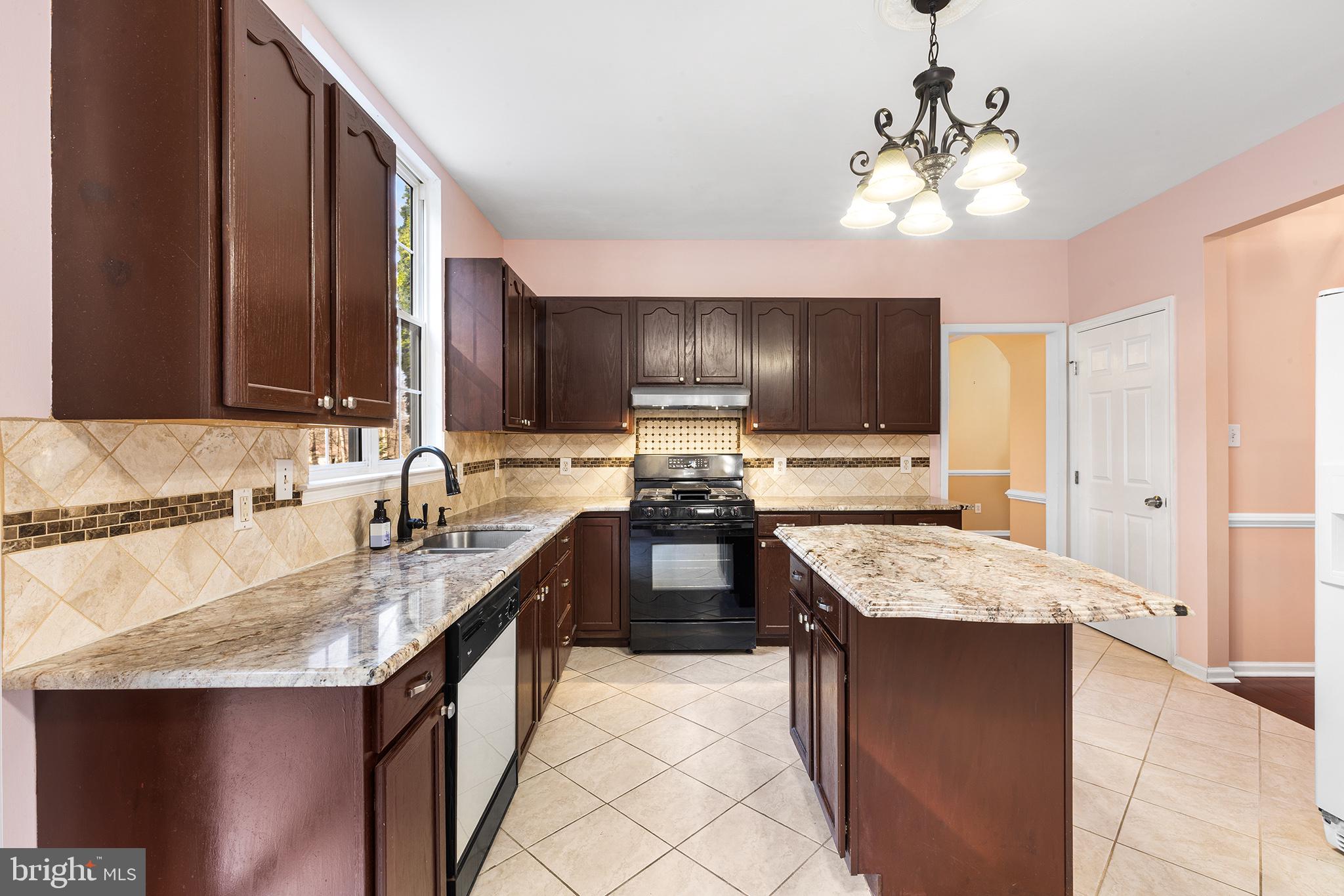 6 Sunset Hollow Road West Chester, PA 19380 - Photo 10 of 46 a kitchen with stainless steel appliances granite countertop a sink stove and refrigerator