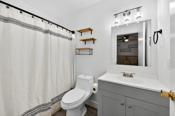 a view of a chairs and table in backyard