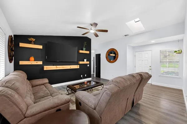 a living room with furniture and a large window