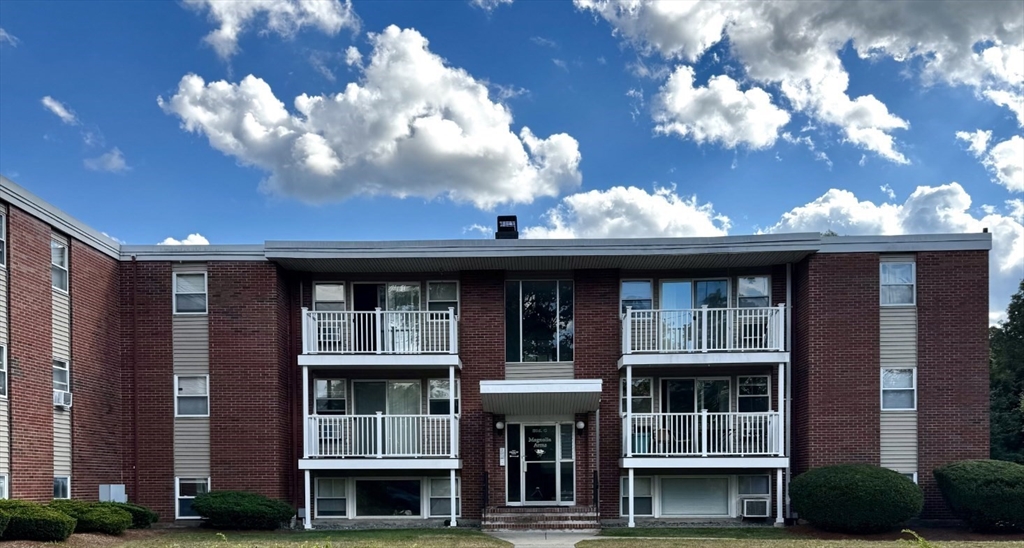 30 Worthen Street, Unit C4 Chelmsford, MA 01824 - Photo 1 of 8 a view of a large building and a window