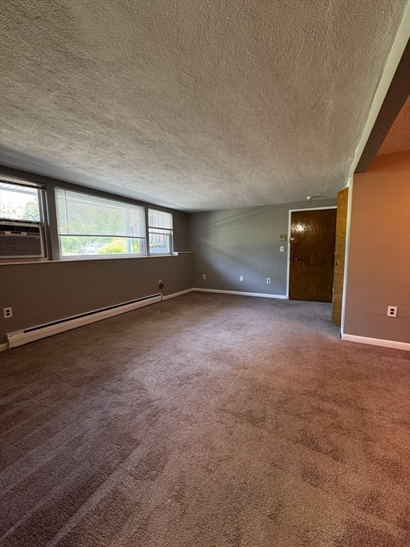 30 Worthen Street, Unit C4 Chelmsford, MA 01824 - Photo 5 of 8 an empty room with wooden floor and windows