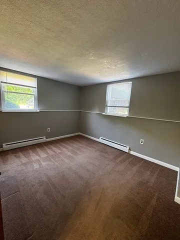 an empty room with a empty space and a window