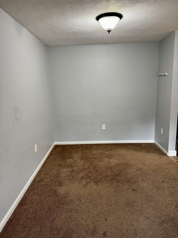 30 Worthen Street, Unit C4 Chelmsford, MA 01824 - Photo 7 of 8 an empty room with a natural light
