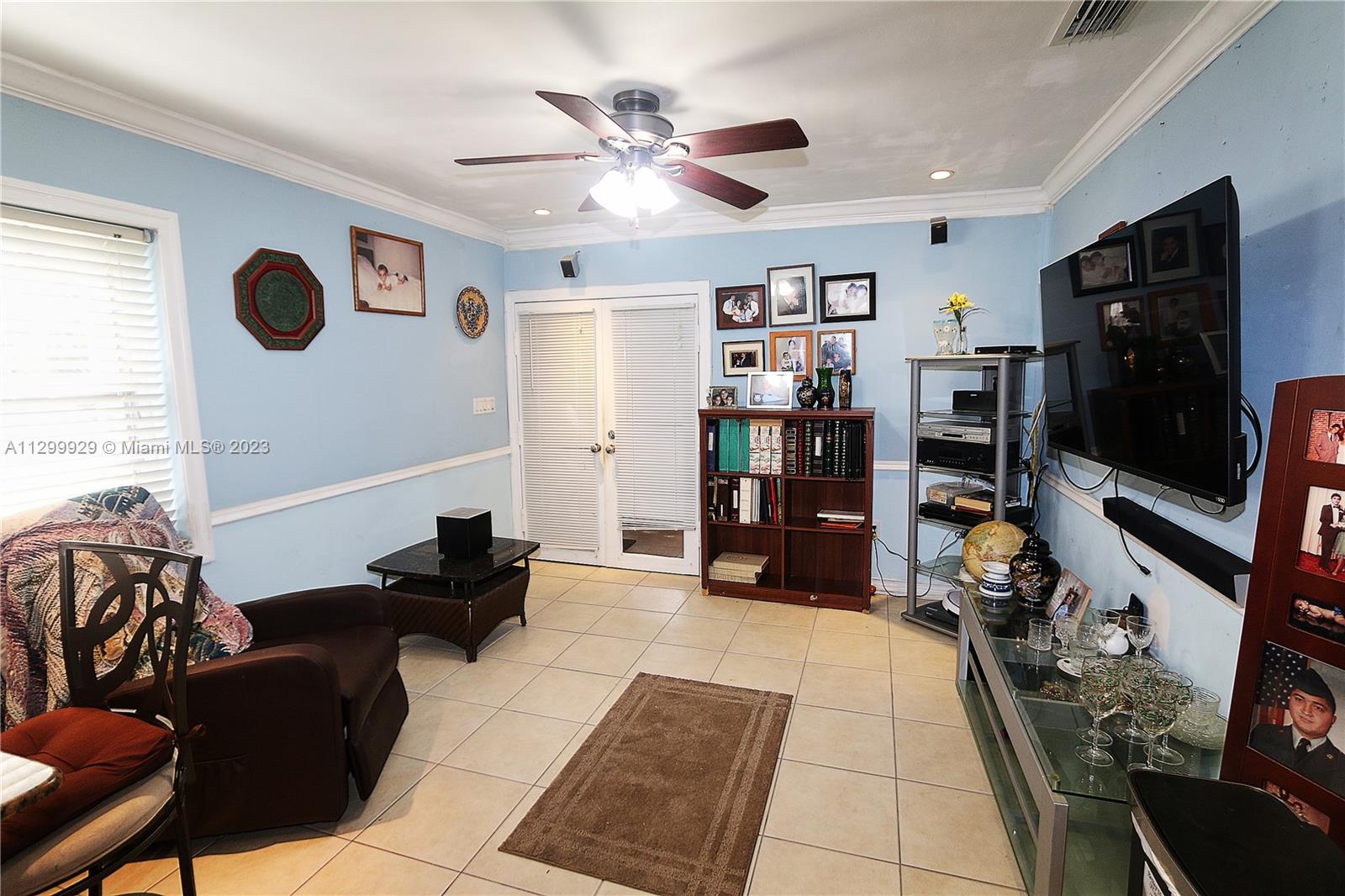 842 Southwest 89th Avenue, Unit A Miami, FL 33174 - Photo 13 of 34 a living room with furniture and a flat screen tv