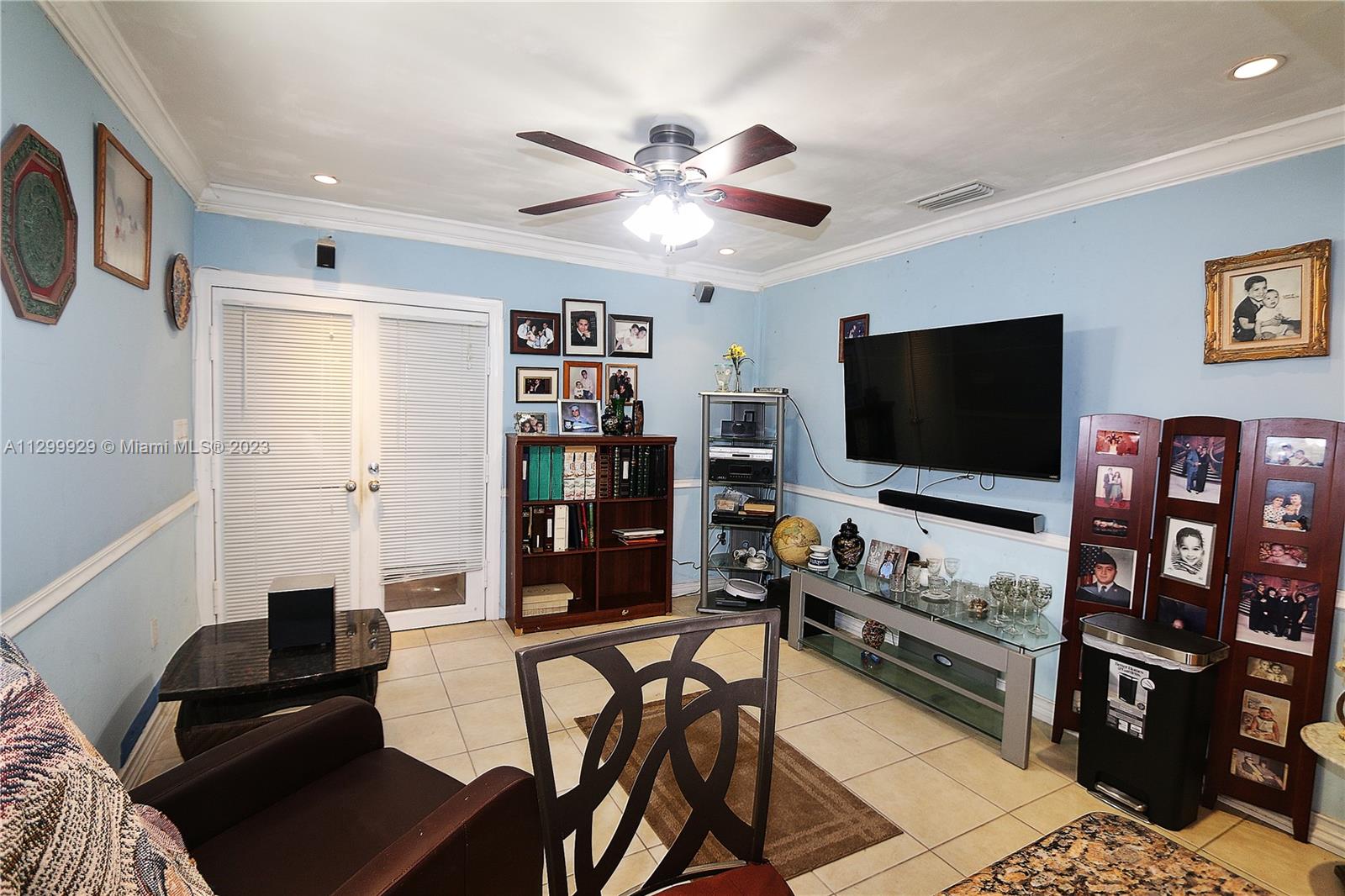 842 Southwest 89th Avenue, Unit A Miami, FL 33174 - Photo 14 of 34 a living room with furniture and a flat screen tv
