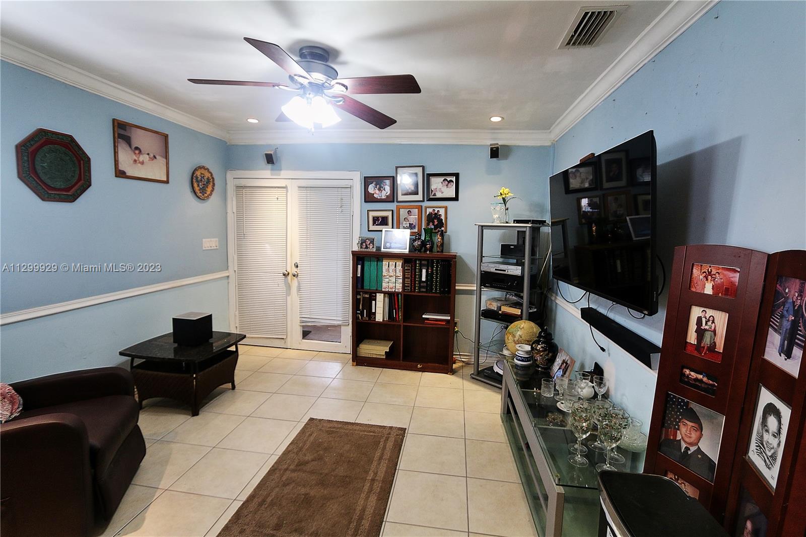 842 Southwest 89th Avenue, Unit A Miami, FL 33174 - Photo 15 of 34 a living room with furniture and a flat screen tv