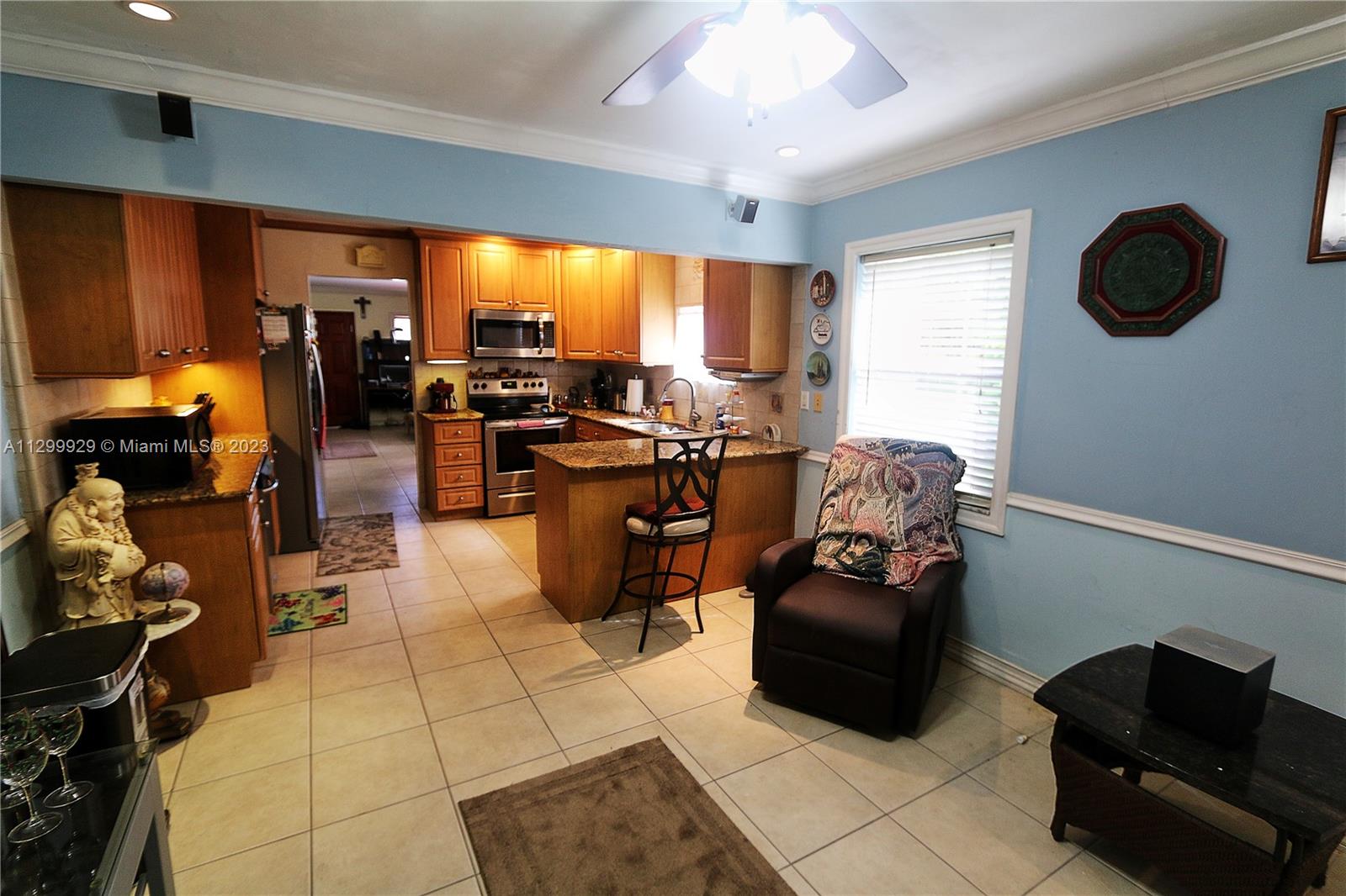 842 Southwest 89th Avenue, Unit A Miami, FL 33174 - Photo 17 of 34 a room with gym equipment and a large window