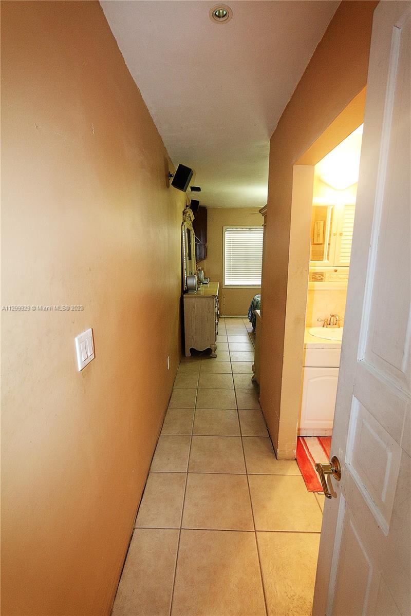 842 Southwest 89th Avenue, Unit A Miami, FL 33174 - Photo 18 of 34 a bathroom with a sink and toilet