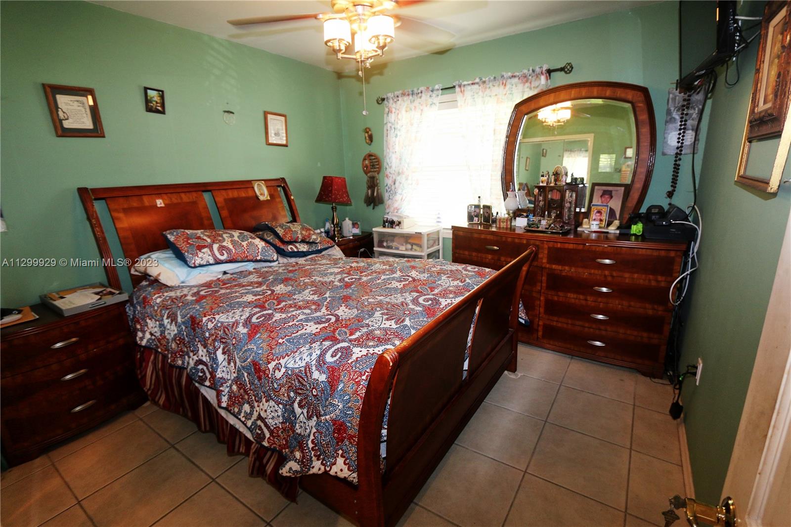 842 Southwest 89th Avenue, Unit A Miami, FL 33174 - Photo 25 of 34 a bedroom with a bed and a dresser