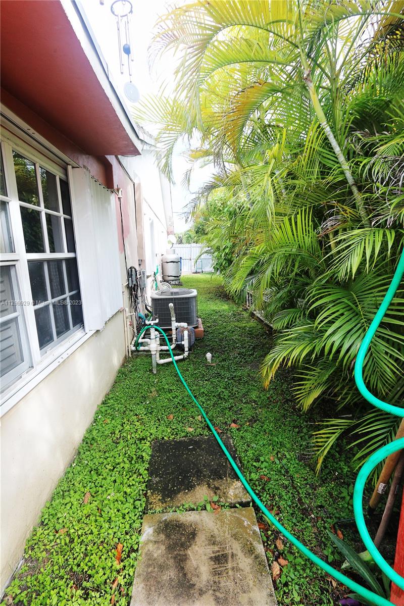 842 Southwest 89th Avenue, Unit A Miami, FL 33174 - Photo 34 of 34 a view of backyard with outdoor seating and plants