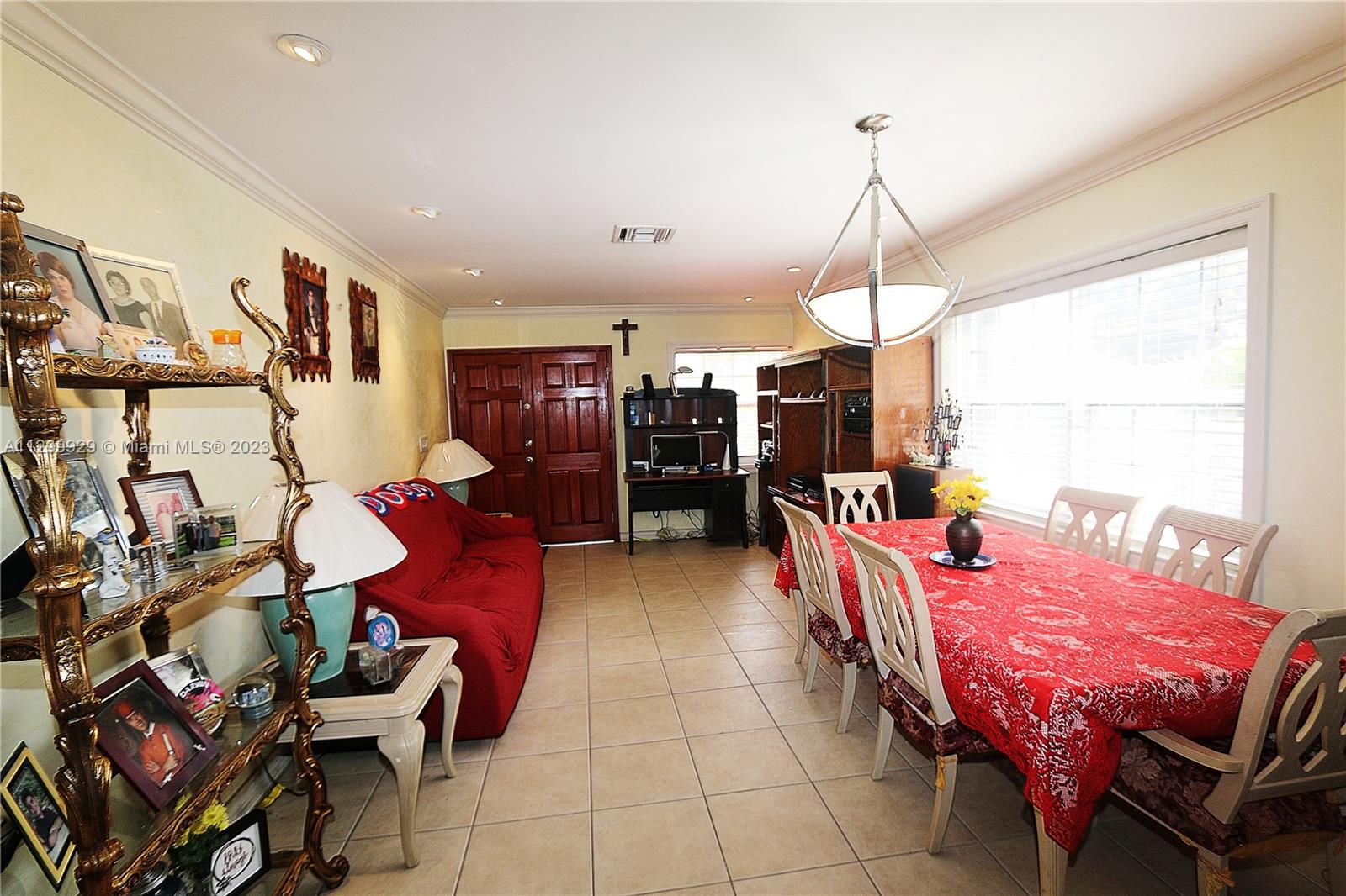 842 Southwest 89th Avenue, Unit A Miami, FL 33174 - Photo 6 of 34 a dining room with furniture and window