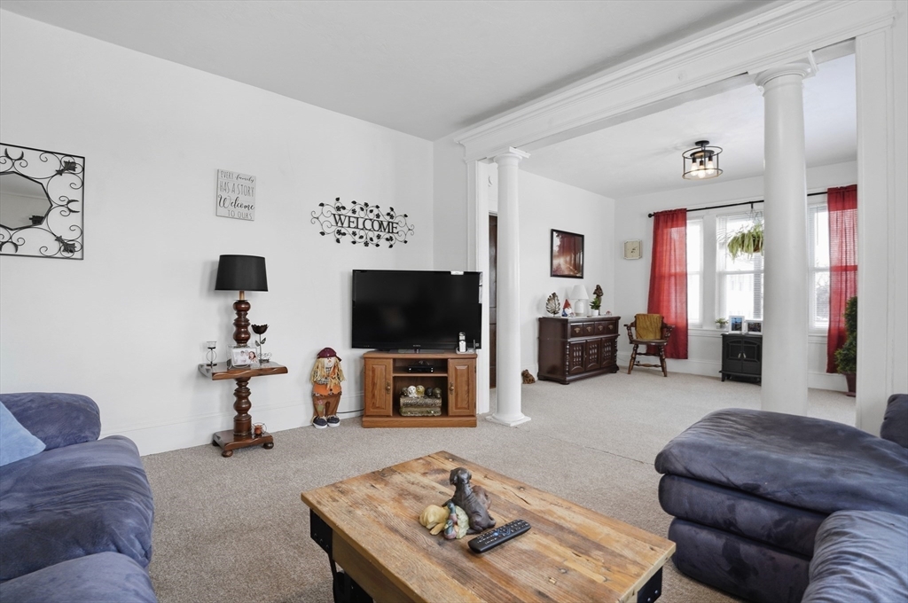 24 Ingleside Avenue Worcester, MA 01604 - Photo 31 of 39 a living room with furniture and a flat screen tv