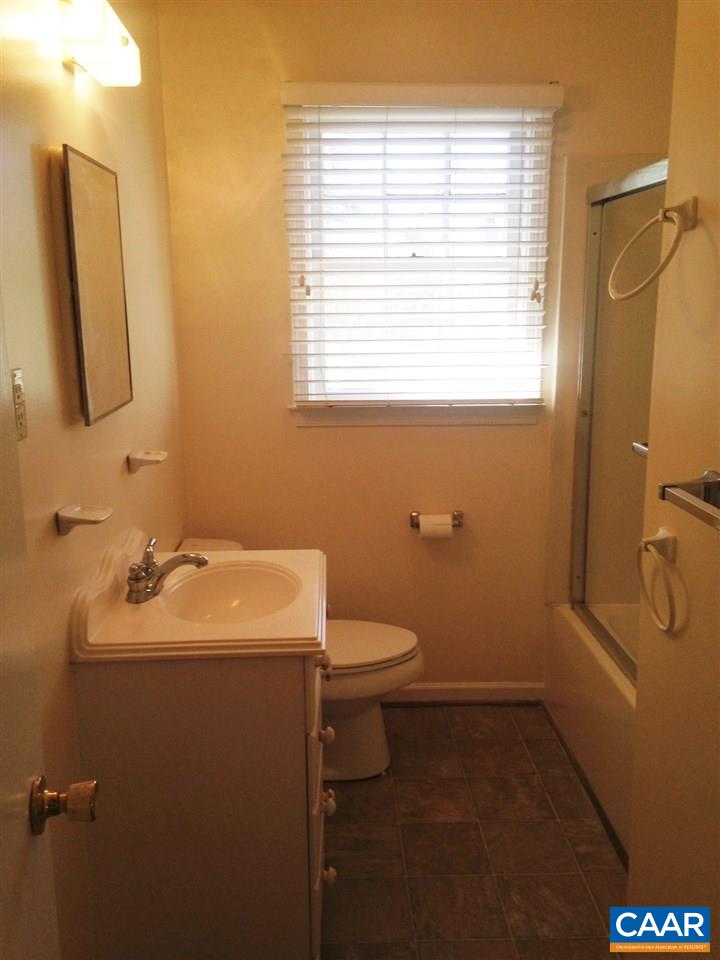 219 Shamrock Road Charlottesville, VA 22903 - Photo 11 of 12 a bathroom with a sink a toilet and a mirror