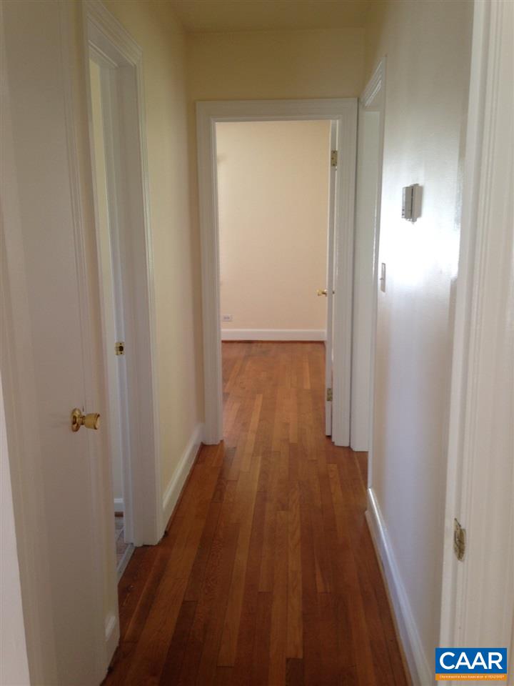 219 Shamrock Road Charlottesville, VA 22903 - Photo 8 of 12 a view of a hallway with wooden floor