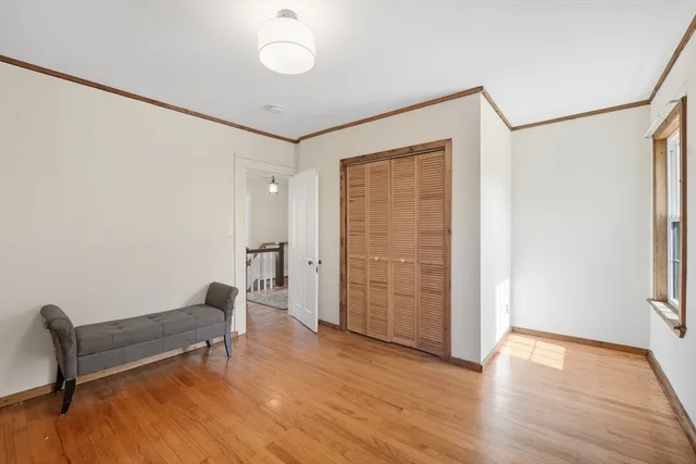 a view of room with furniture and wooden floor