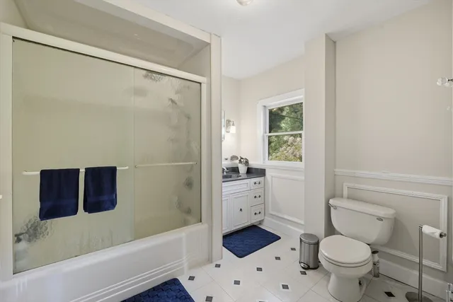 a bathroom with a toilet a sink and a bathtub