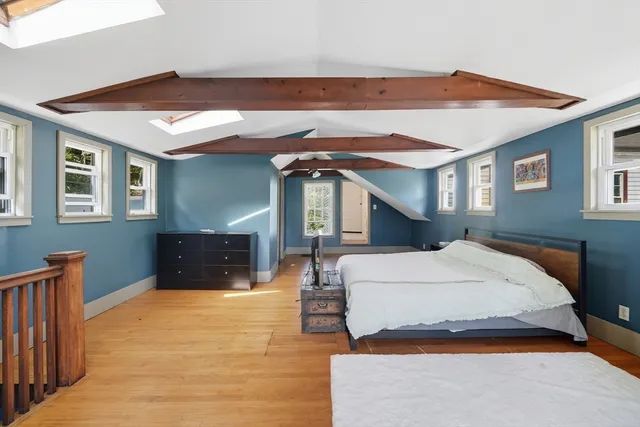 a bed room with a bed and a chandelier