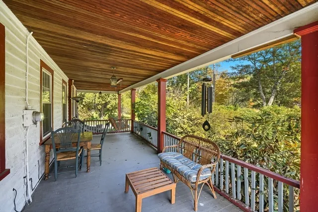 a view of a chairs and table in the balcony
