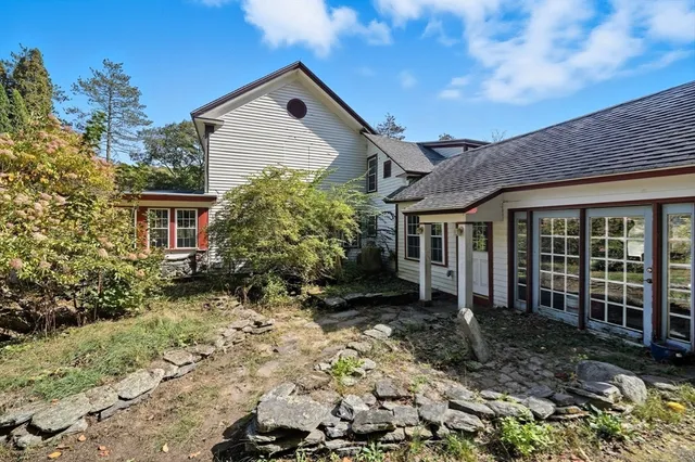 a view of a house with a garden