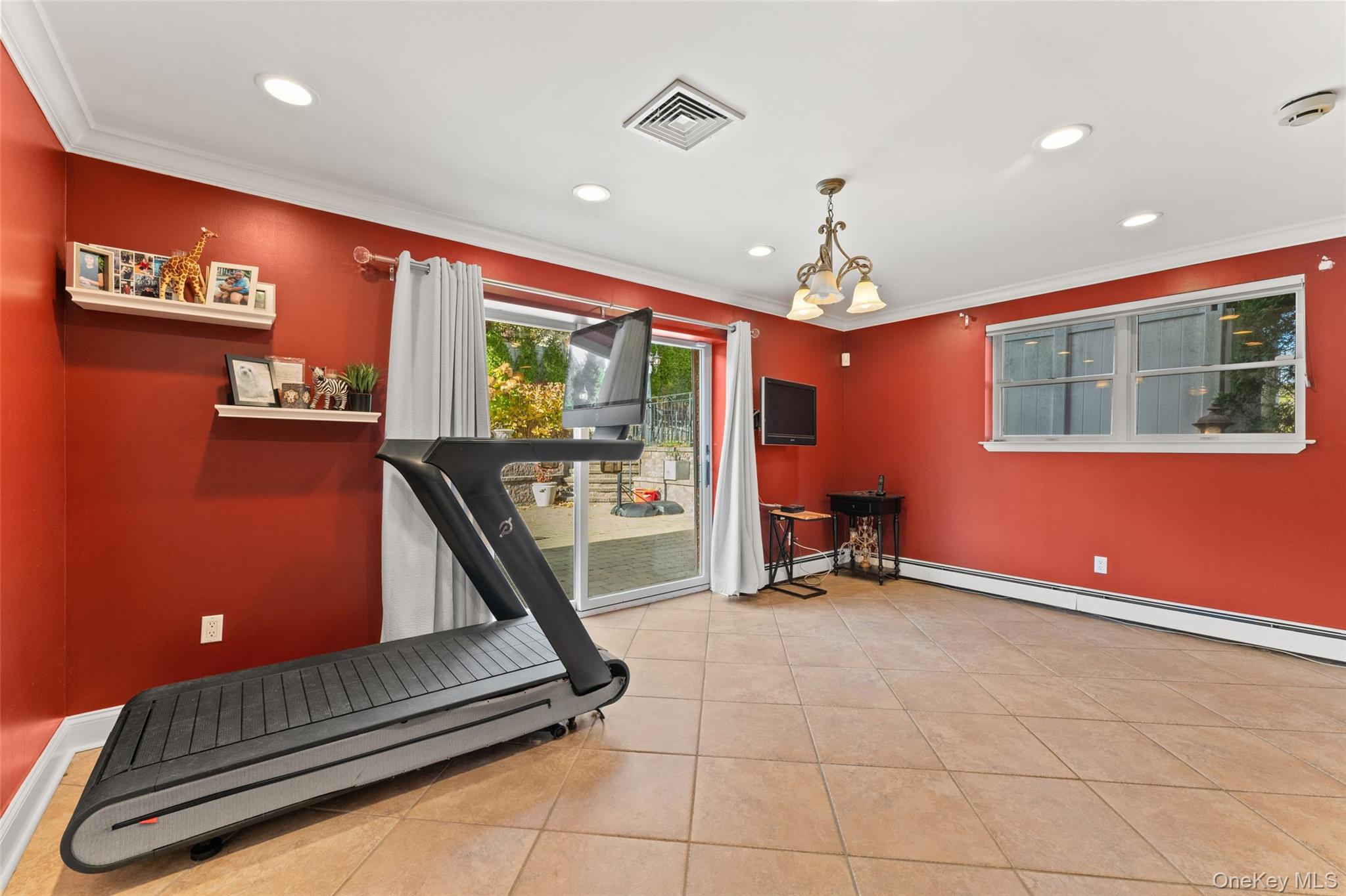 6 Hunting Ridge Road White Plains, NY 10605 - Photo 19 of 32 a living room with furniture gym equipment and large windows