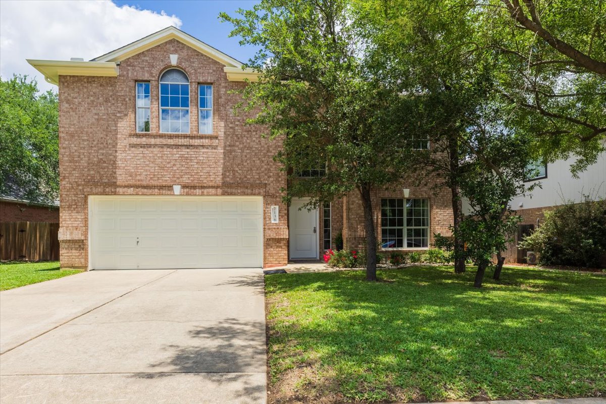 7136 Ridge Oak Road Austin, TX 78749 - Photo 1 of 28 A classic brick facade and a tidy front yard create inviting curb appeal.