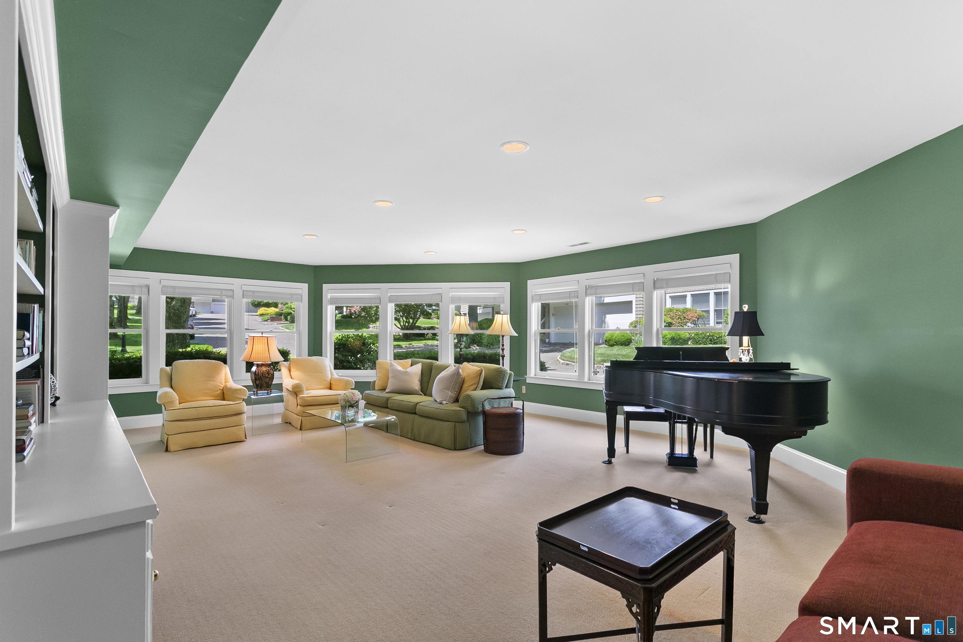 936 South Pine Creek Road Fairfield, CT 06824 - Photo 24 of 39 Expansive great room with wall of windows, built-ins and abundant natural light.
