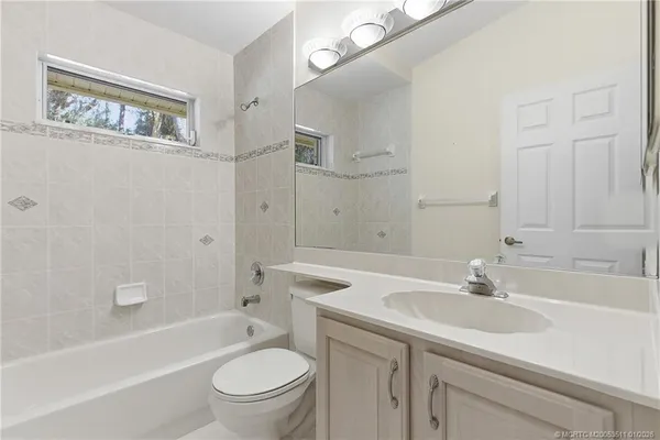 a bathroom with a sink a toilet and a bathtub